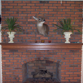 Brick fireplace prior to cleaning services by Desert Tile and Grout Care
