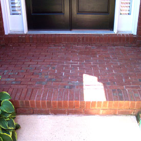 In Phoenix Arizona dust covers this otherwise beautiful brick entryway before contacting Desert Tile and Grout Care