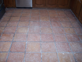 Before being cleaned this floor in Phoenix Arizona was covered in white paint during remodeling