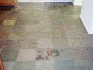 Stone floor before professional Desert Tile & Grout Care services