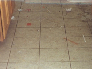 Dirty white ceramic tiled floor in Mesa Arizona prior to professional cleaning services