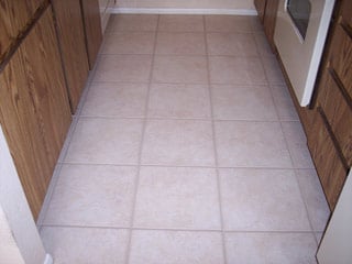 This ceramic tile kitchen floor has been restored to looking brand new by cleaning services by Desert Tile and Grout Care