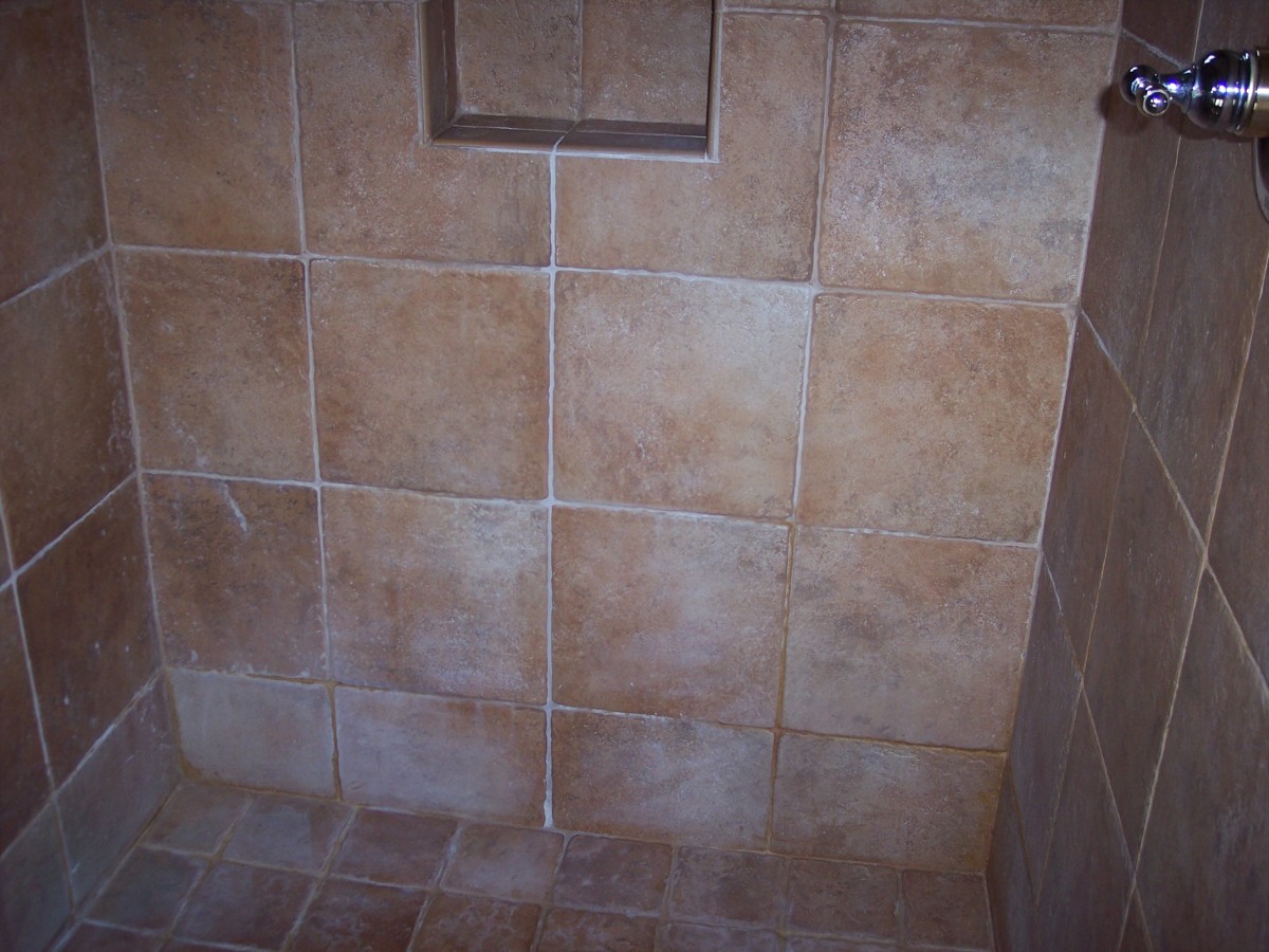 A shower in Tempe Arizona before being cleaned and renewed by Desert Tile and Grout Care