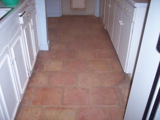 Dirty Mexican Saltillo tile floor in historic home in Phoenix, Arizona