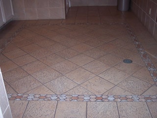 Ceramic tile floor in need of expert deep cleaning tile services