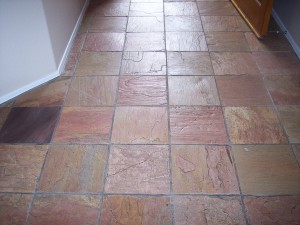 Stone floor before being treated by desert tile and grout care