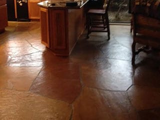 stone floor project before professional cleaning services